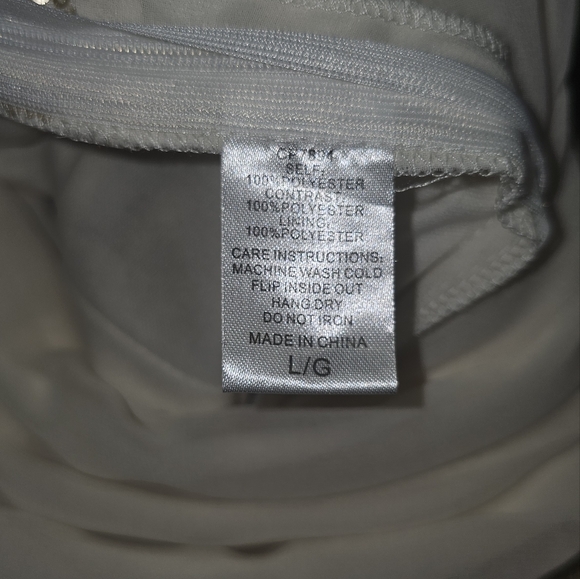 3/20.00. Classy white romper with sequins. - Picture 10 of 10